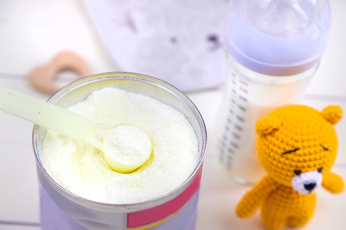 baby bottle with milk on white background. selective focus.