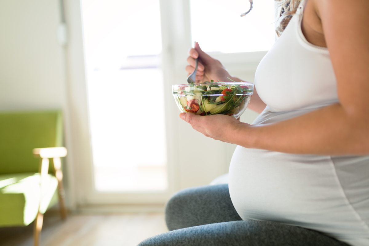 pregnant woman eating healthy food