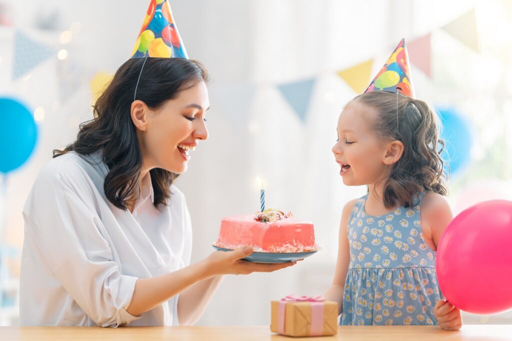 mother and daughter are celebrating birthday.